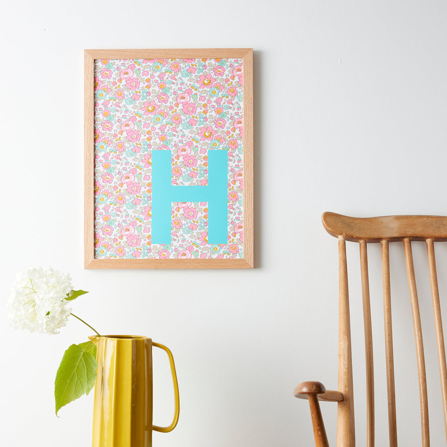 Catherine Colebrook framed Liberty initial picture, in Betsy Pink fabric with turquoise letter, in an oak frame
