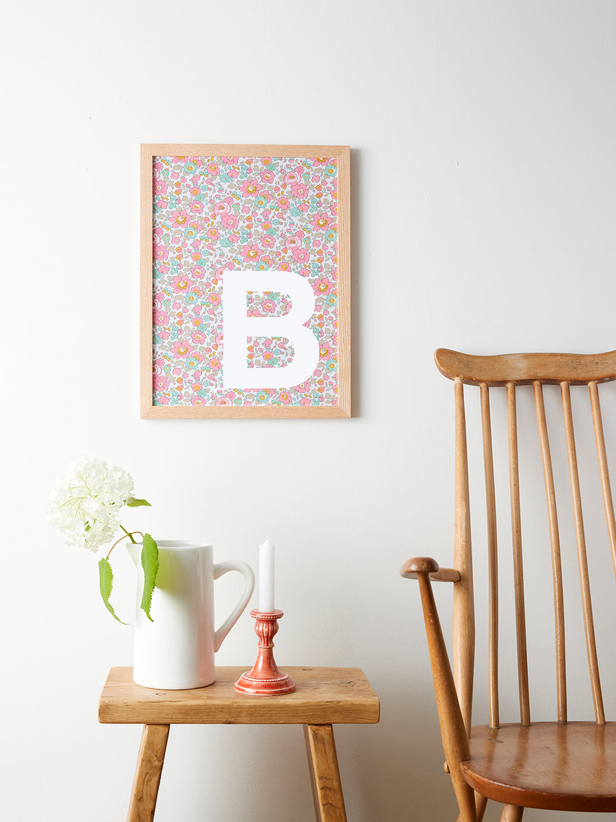 Catherine Colebrook framed Liberty initial picture, in Betsy Pink fabric with white letter, in an oak frame
