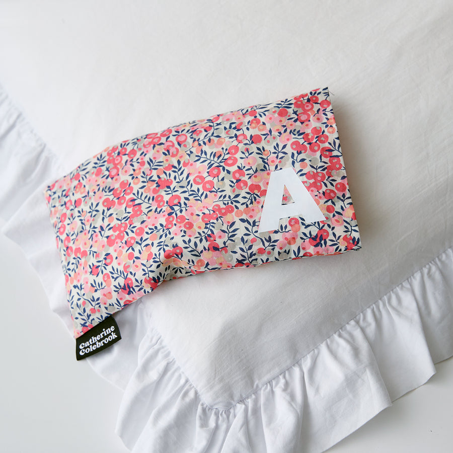 Catherine Colebrook peach Liberty eye pillow with white initial on the bottom right with optional lavender