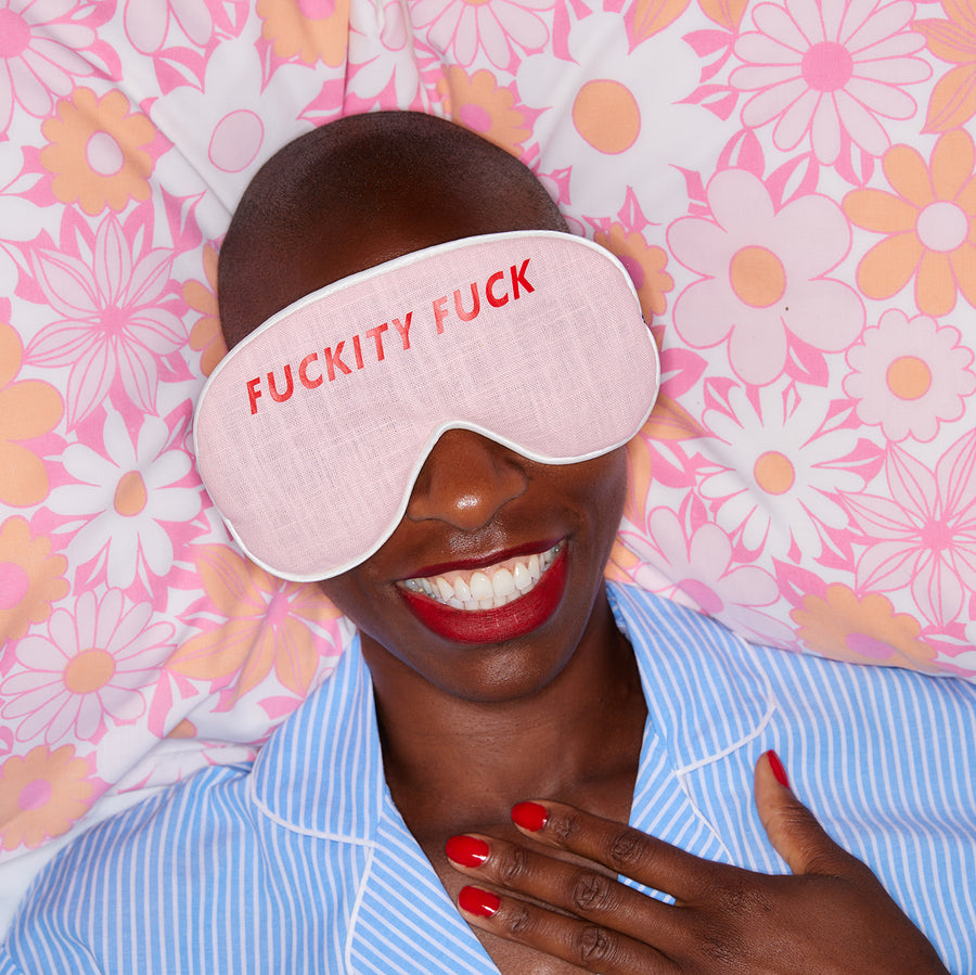 WOMAN WEARING AN EYE MASK WHICH SAYS FUCKITY FUCK
