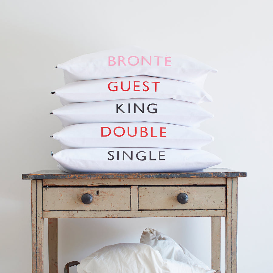 CATHERINE COLEBROOK BEDDING BAGS STACKED UP