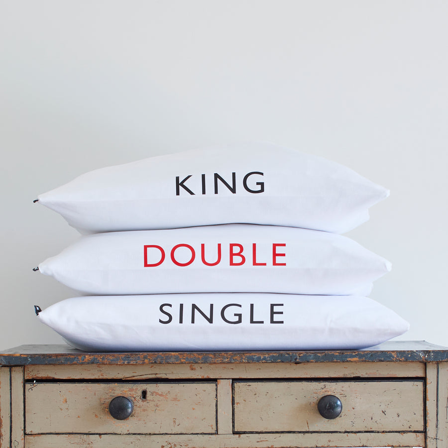 CATHERINE COLEBROOK BEDDING BAGS STACKED UP