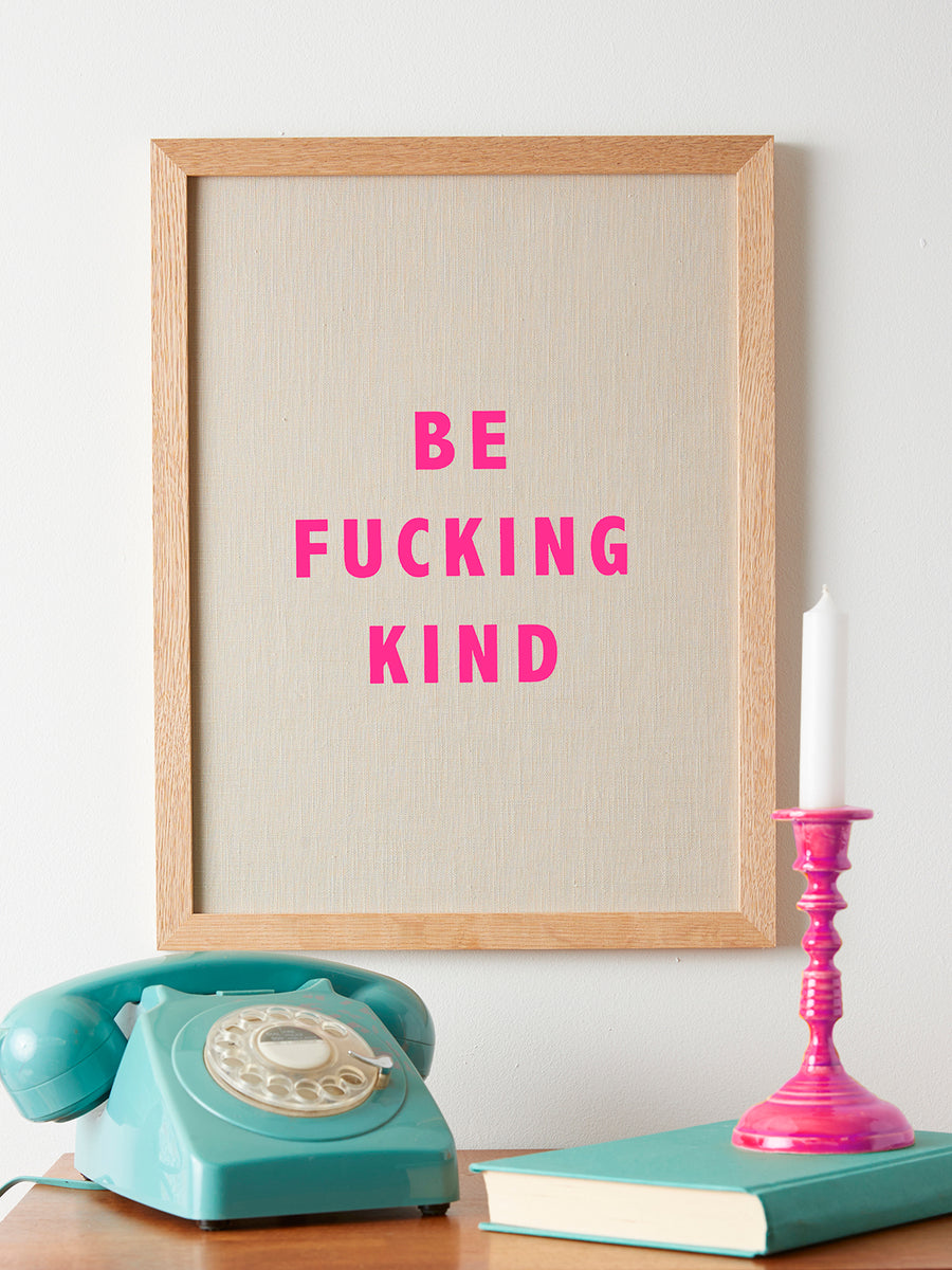 Catherine Colebrook framed linen quote picture, 'Be Fucking Kind' in natural linen with pink neon text, in an oak frame