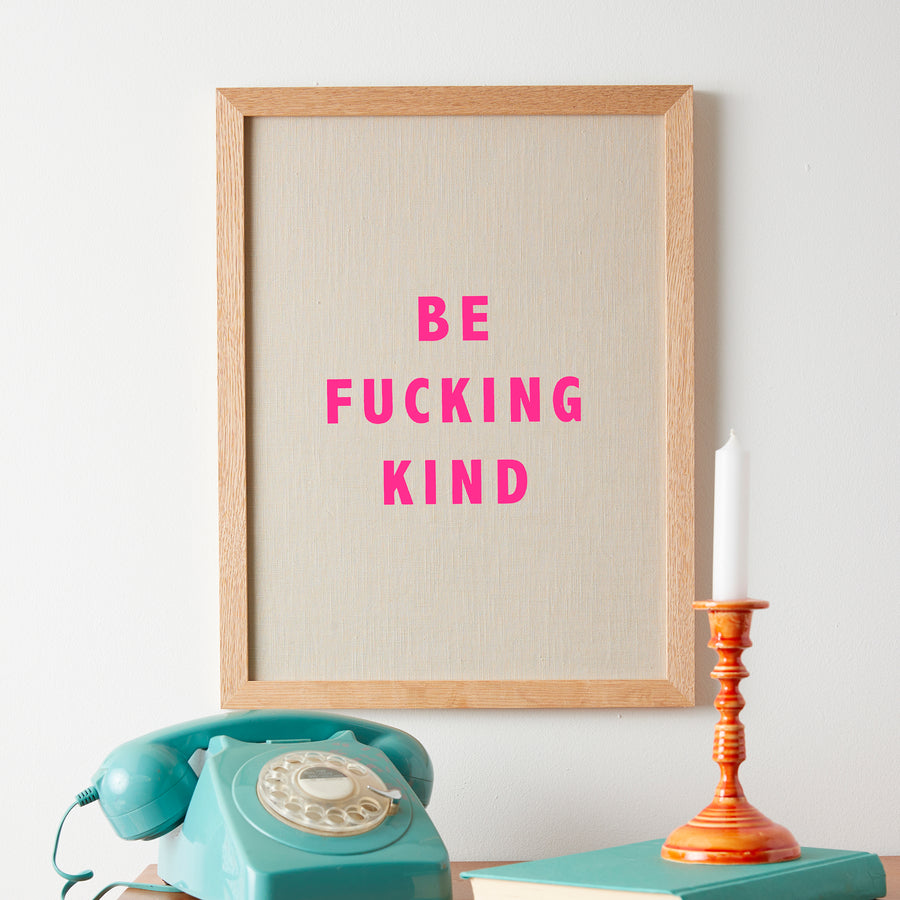 Catherine Colebrook framed linen quote picture, 'Be Fucking Kind' in natural linen with pink neon text, in an oak frame