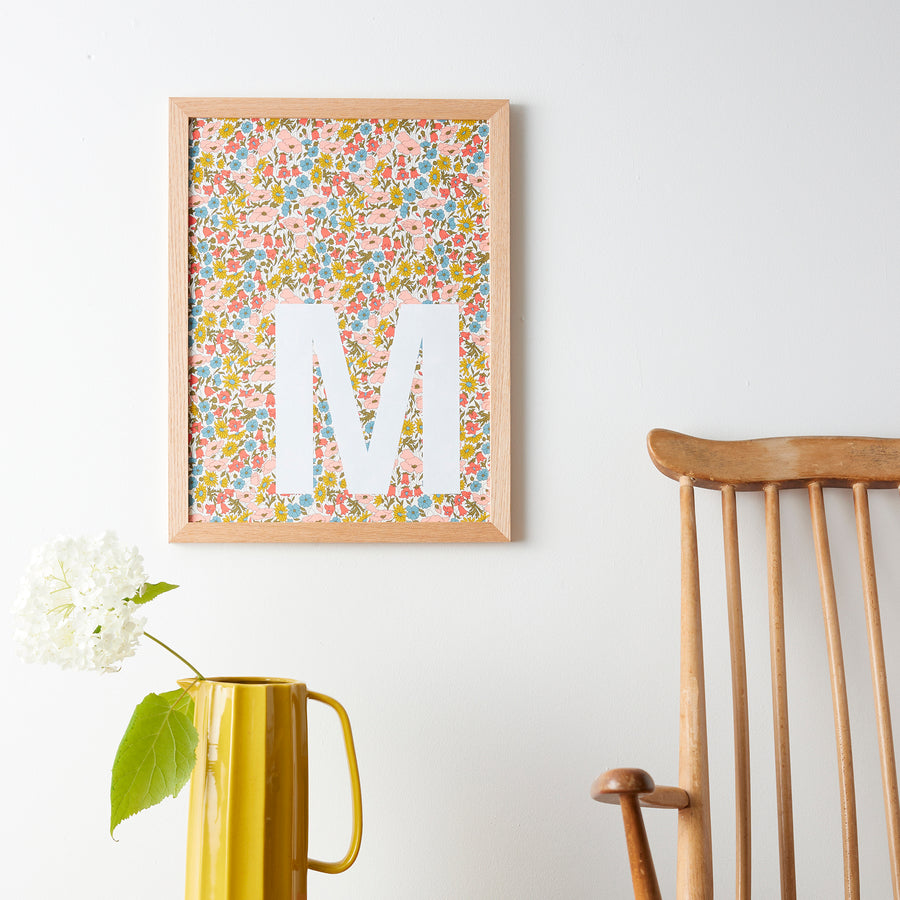 Catherine Colebrook framed Liberty initial picture, in Poppy & Daisy fabric with white letter, in an oak frame