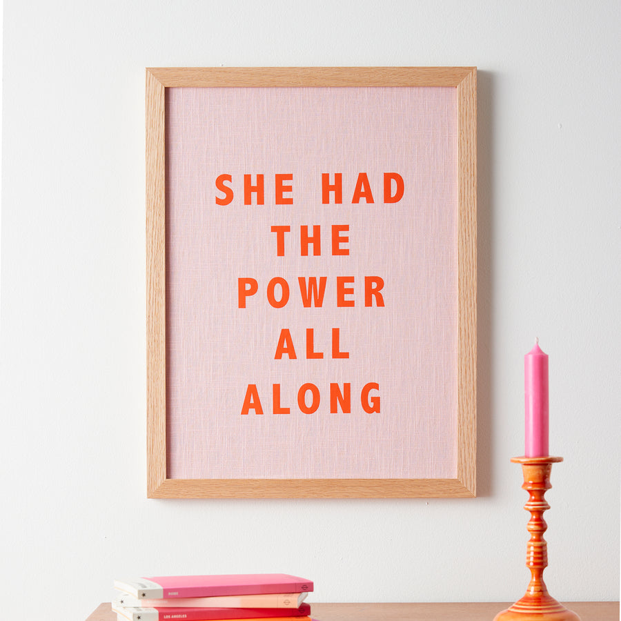Catherine Colebrook framed linen quote picture, ’She Had the Power All Along' in pink linen with orange text, in an oak frame