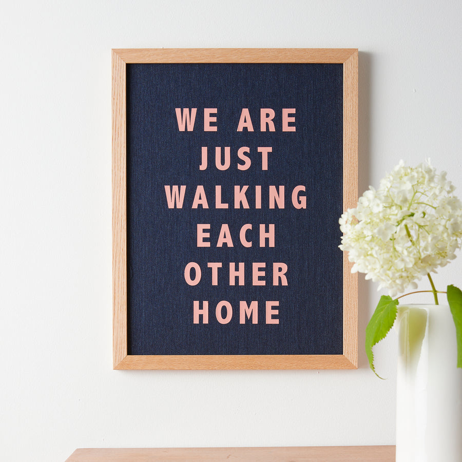 Catherine Colebrook framed denim quote picture, ‘Walking Each Other Home' in denim with salmon pink text, in an oak frame