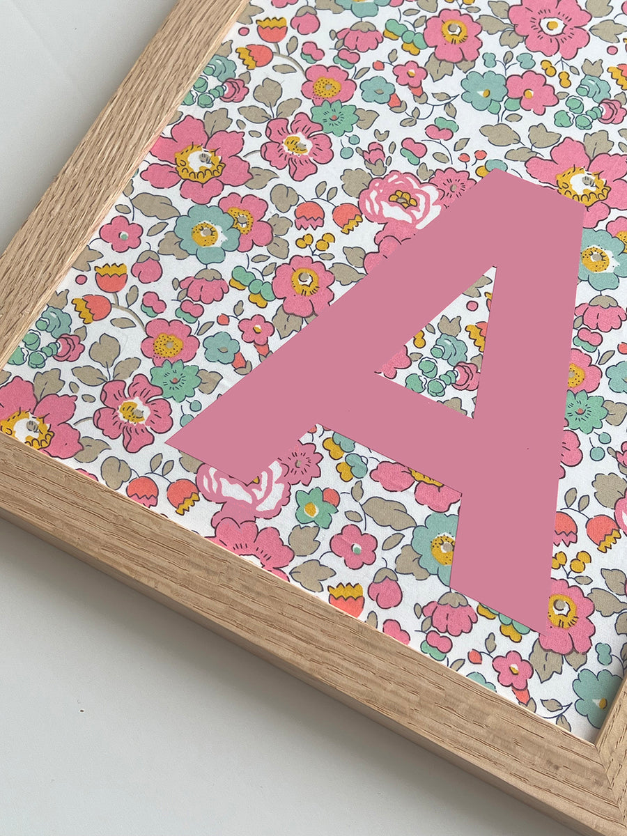 Catherine Colebrook framed Liberty initial picture, in Betsy Pink fabric with pink letter, in an oak frame