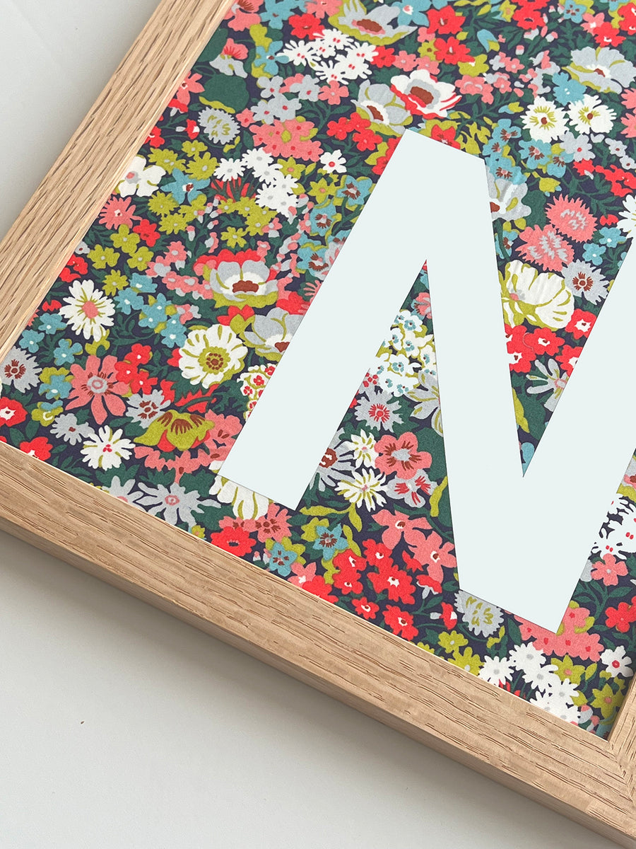 Catherine Colebrook framed Liberty initial picture, in Thorpe Tana Mustard fabric with white letter, in an oak frame - close up