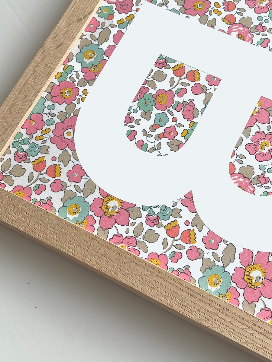 Catherine Colebrook framed Liberty initial picture, in Betsy Pink fabric with white letter, in an oak frame - close up