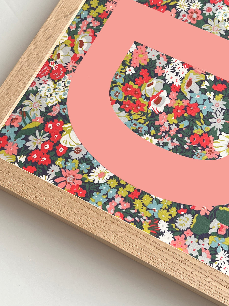 Catherine Colebrook framed Liberty initial picture, in Thorpe Tana Mustard fabric with salmon pink letter, in an oak frame - close up