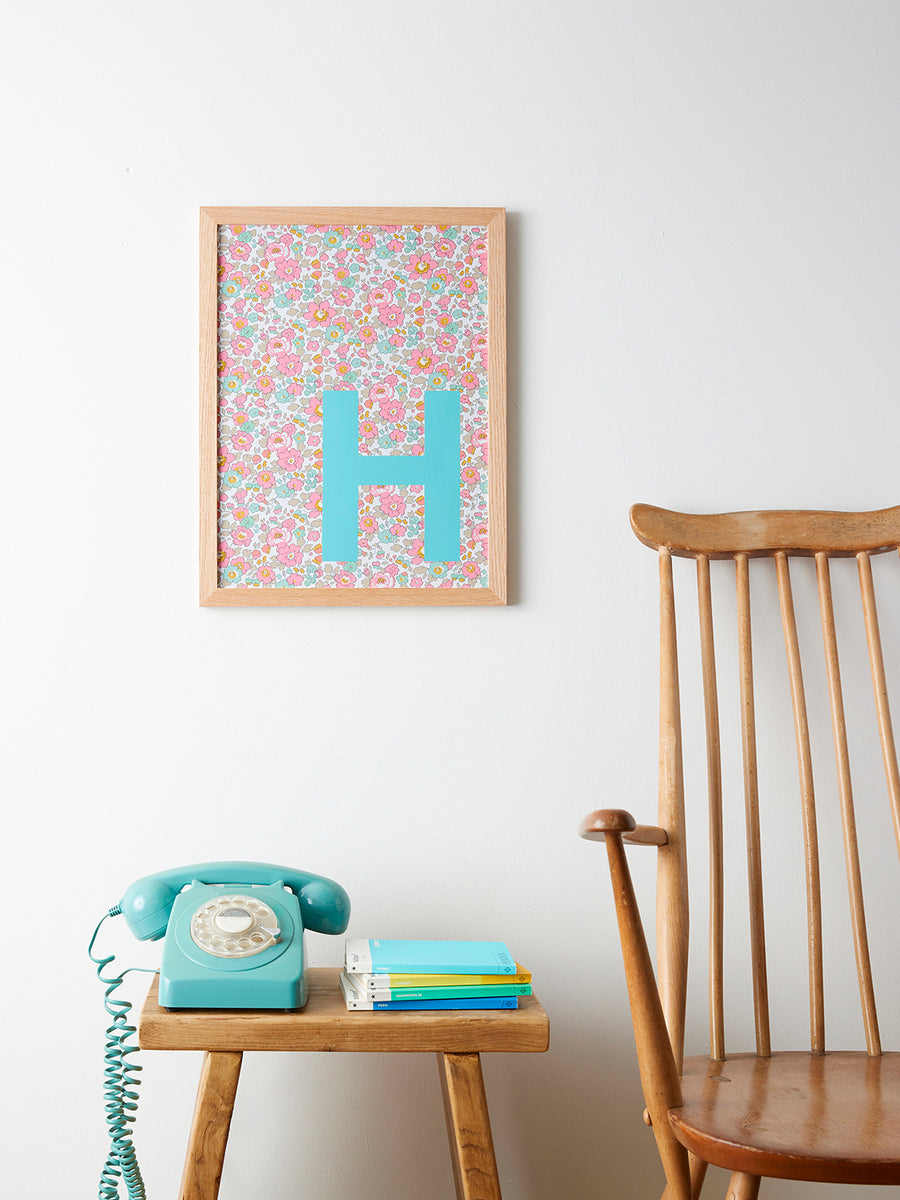Catherine Colebrook framed Liberty initial picture, in Betsy Pink fabric with turquoise letter, in an oak frame