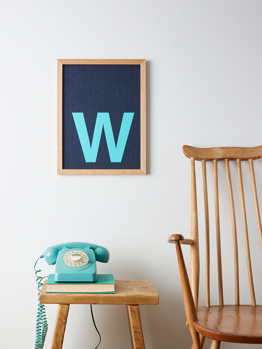 Catherine Colebrook framed denim initial picture, in denim with turquoise letter, in an oak frame