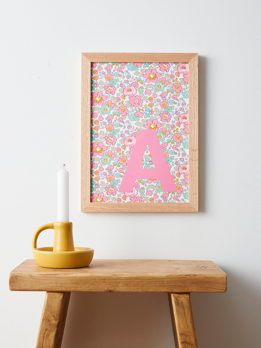 Catherine Colebrook framed Liberty initial picture, in Betsy Pink fabric with pink letter, in an oak frame