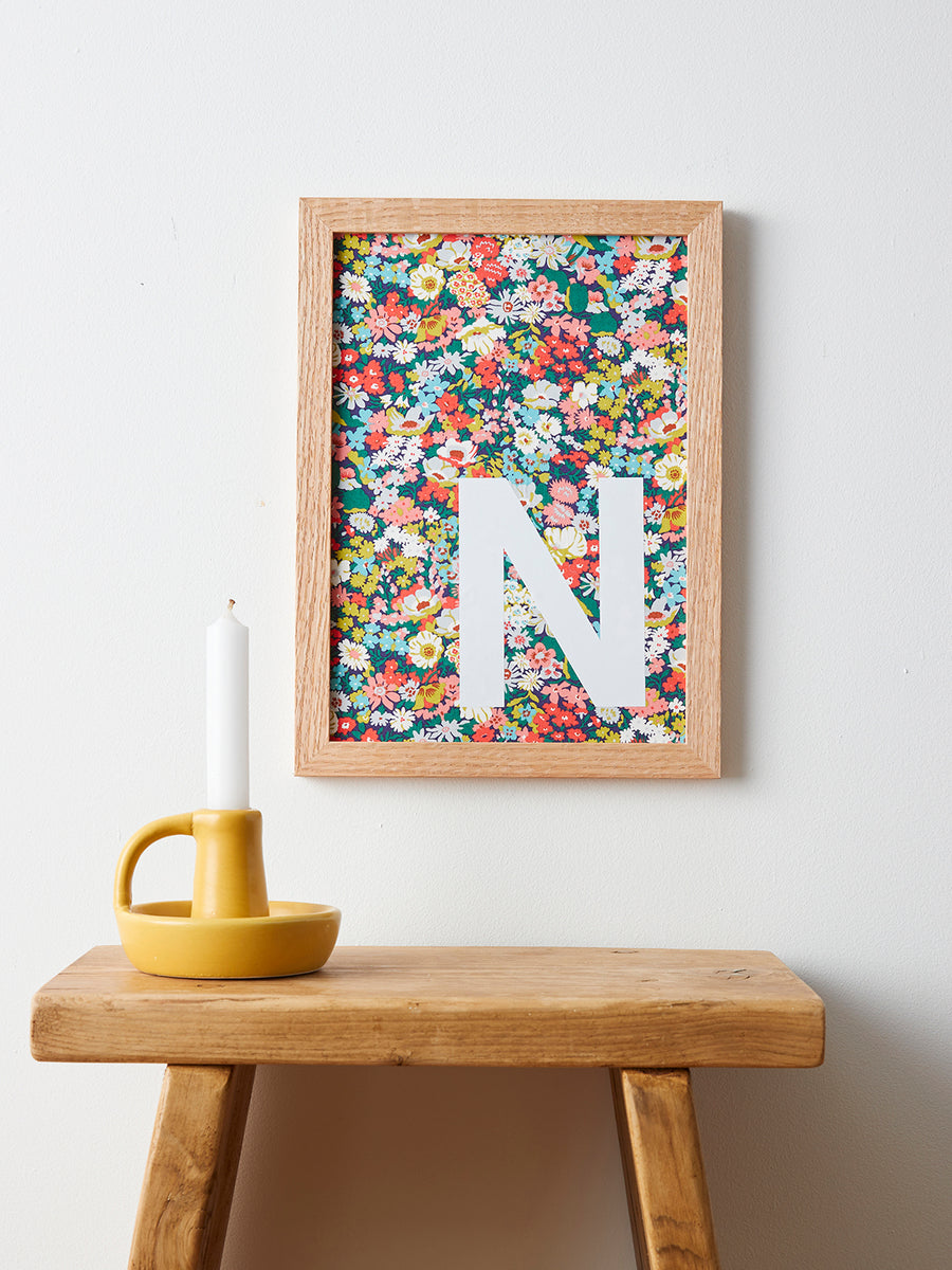 Catherine Colebrook framed Liberty initial picture, in Thorpe Tana Mustard fabric with white letter, in an oak frame