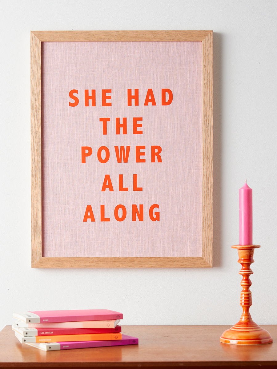 Catherine Colebrook framed linen quote picture, ’She Had the Power All Along' in pink linen with orange text, in an oak frame