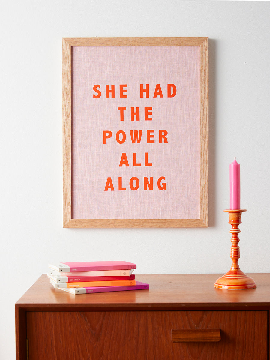 Catherine Colebrook framed linen quote picture, ’She Had the Power All Along' in pink linen with orange text, in an oak frame