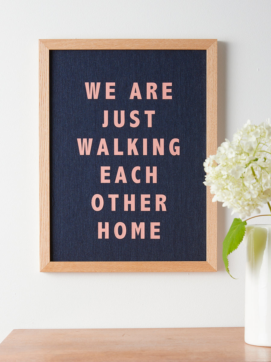 Catherine Colebrook framed denim quote picture, ‘Walking Each Other Home' in denim with salmon pink text, in an oak frame