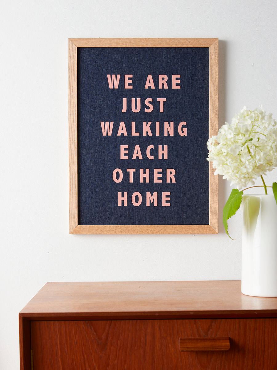 Catherine Colebrook framed denim quote picture, ‘Walking Each Other Home' in denim with salmon pink text, in an oak frame