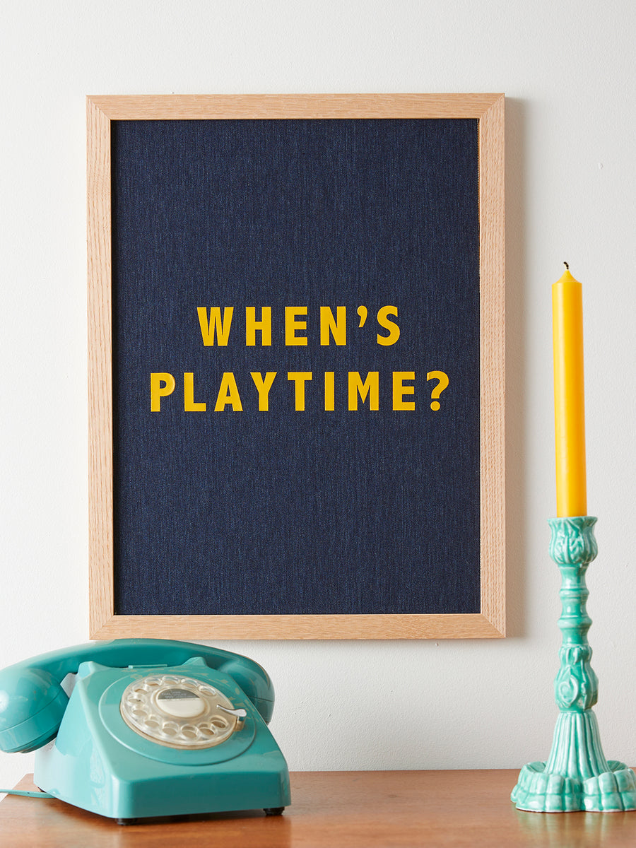 Catherine Colebrook framed denim quote picture, ‘When’s Playtime?' in denim with yellow text, in an oak frame