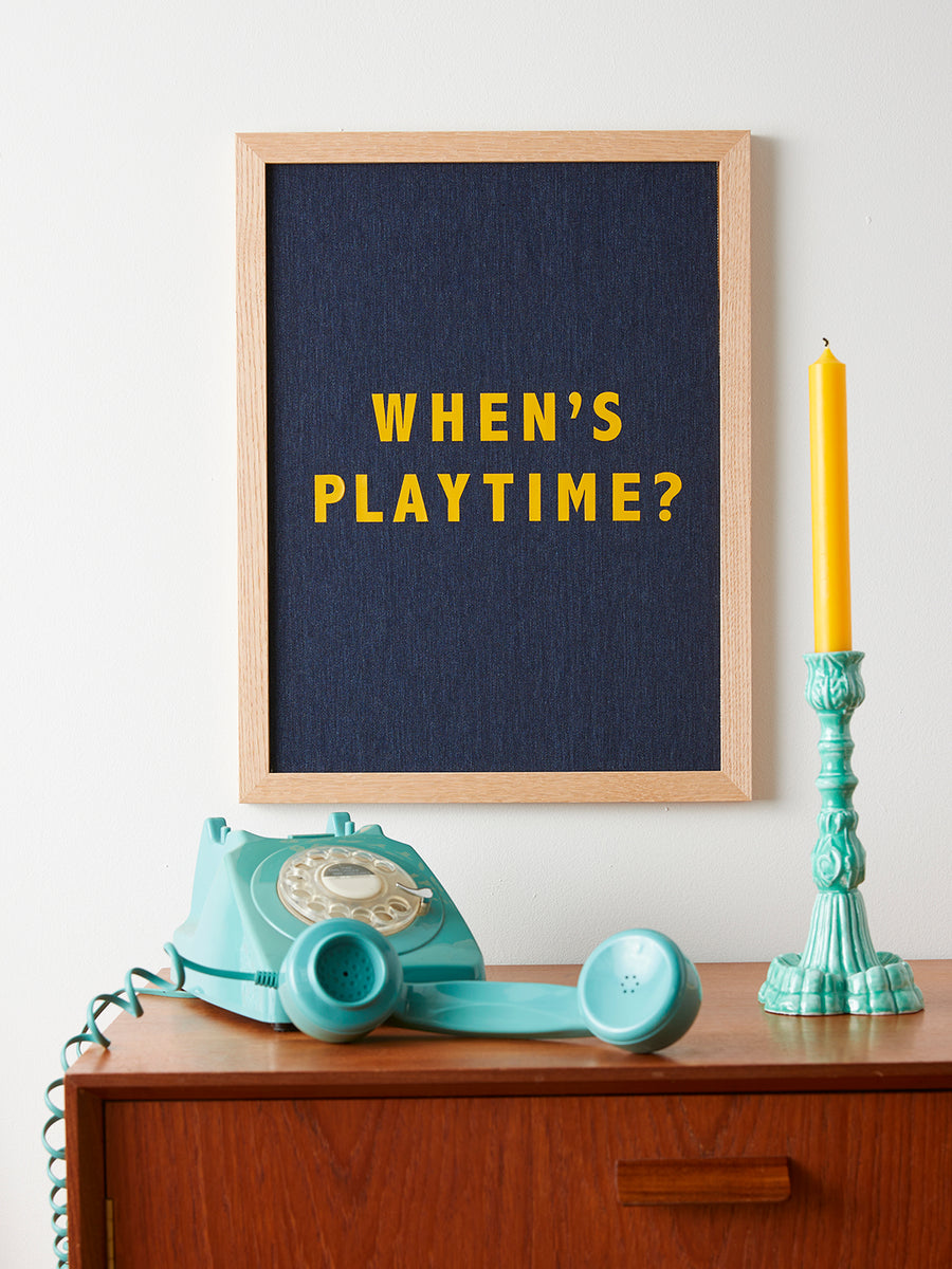 Catherine Colebrook framed denim quote picture, ‘When’s Playtime?' in denim with yellow text, in an oak frame