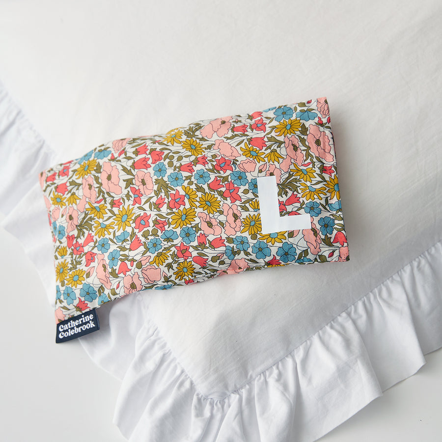 Catherine Colebrook floral Liberty eye pillow with white initial on the bottom right with optional lavender
